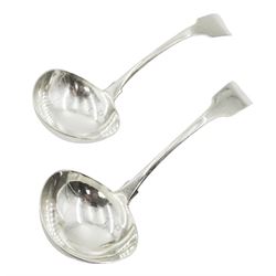 Pair of George III Irish silver sauce ladles, Fiddle pattern with a slightly twisted stem, hallmarked Dublin 1808, maker's mark JK, attributed to Joseph Kinselagh of Cork