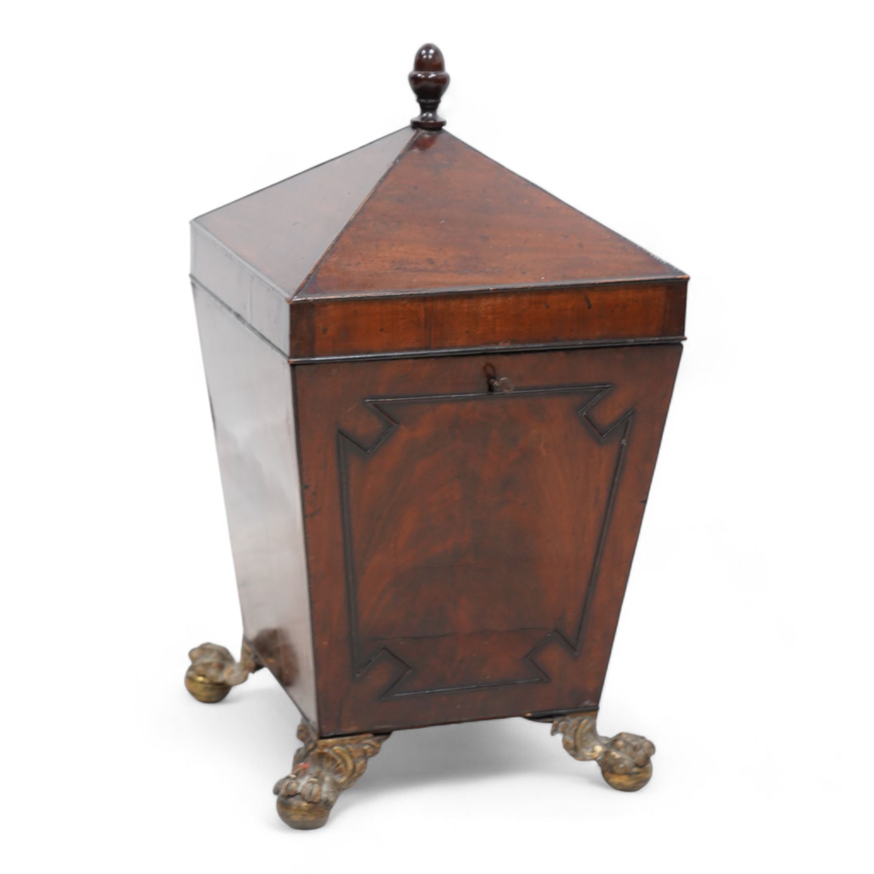 George III mahogany wine cooler or cellarette, the pointed hinged lid with turned final, square tapering body with applied geometric mouldings, on gilt metal and foliate cast ball and claw feet, with metal liner 