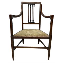 Edwardian satinwood inlaid mahogany elbow chair, the bar back over four vertical rails with foliate and scroll carved decoration, curved and down-swept arms, on square tapering supports united by stretchers 