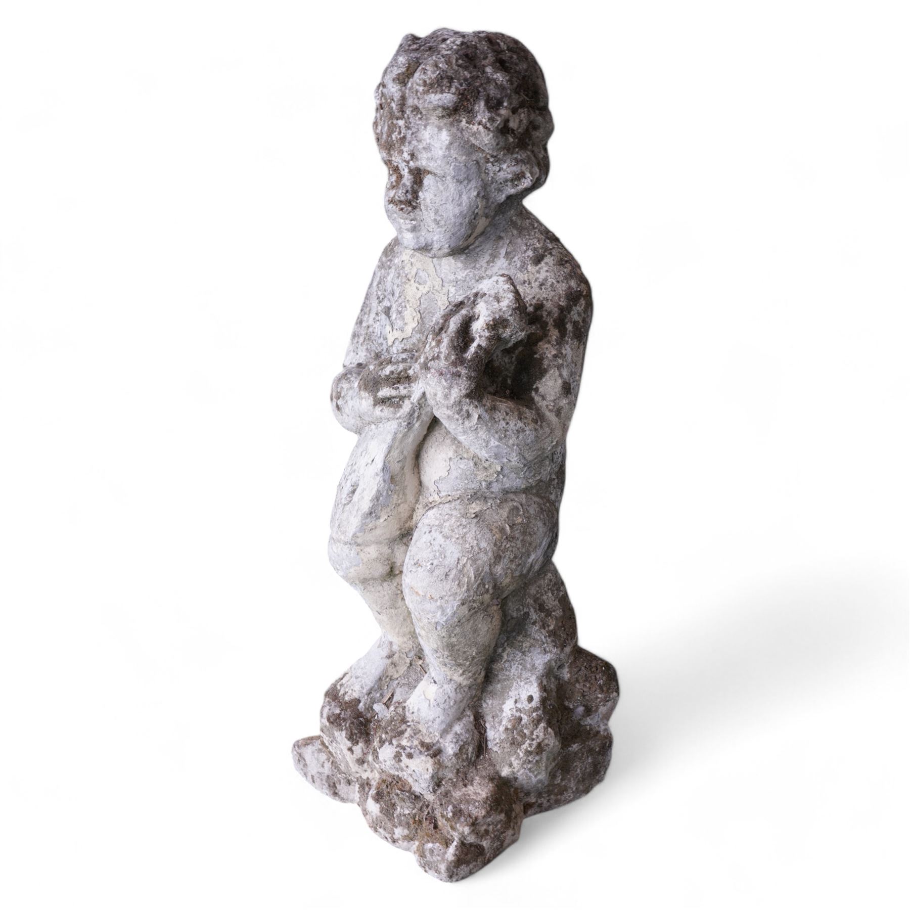 Cast stone figure of a cherub playing a mandolin on rocky base 