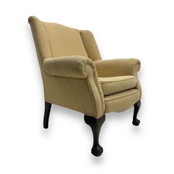 Late 20th century Queen Anne design wingback armchair, upholstered in pale yellow fabric w...