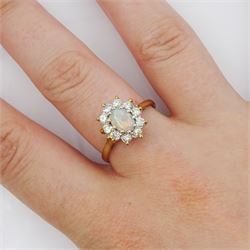 9ct gold oval opal and round brilliant cut diamond cluster ring, London 1982, total diamond weight approx 0.30 carat