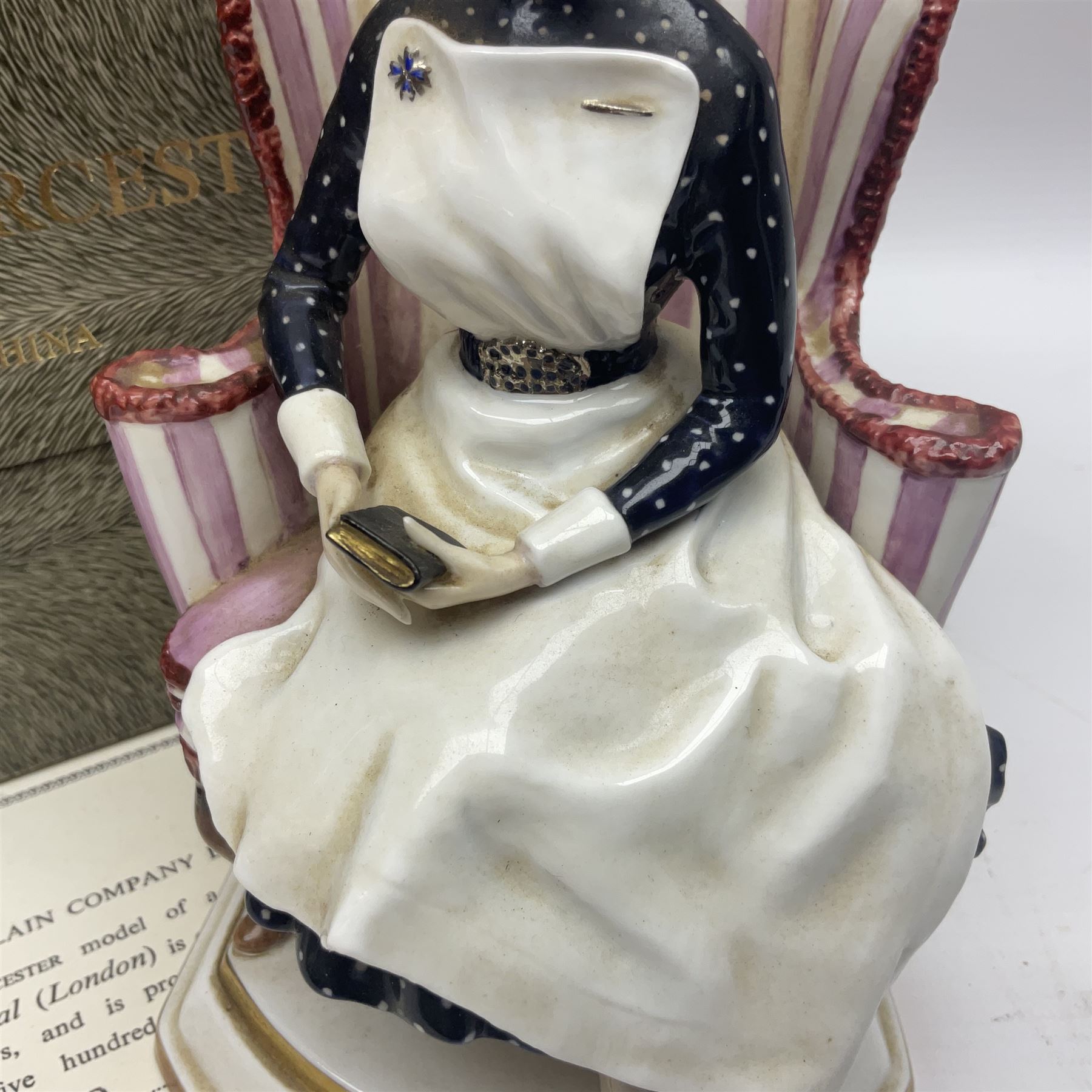 Royal Worcester limited edition figure, Sister St Thomas Hospital (London), no 180/500, modelled as a nurse in uniform, sitting on a striped wingback chair, with printed mark beneath, in original box with certificate, H16cm