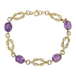 9ct gold four stone oval cut amethyst and knot design bracelet, London 1972