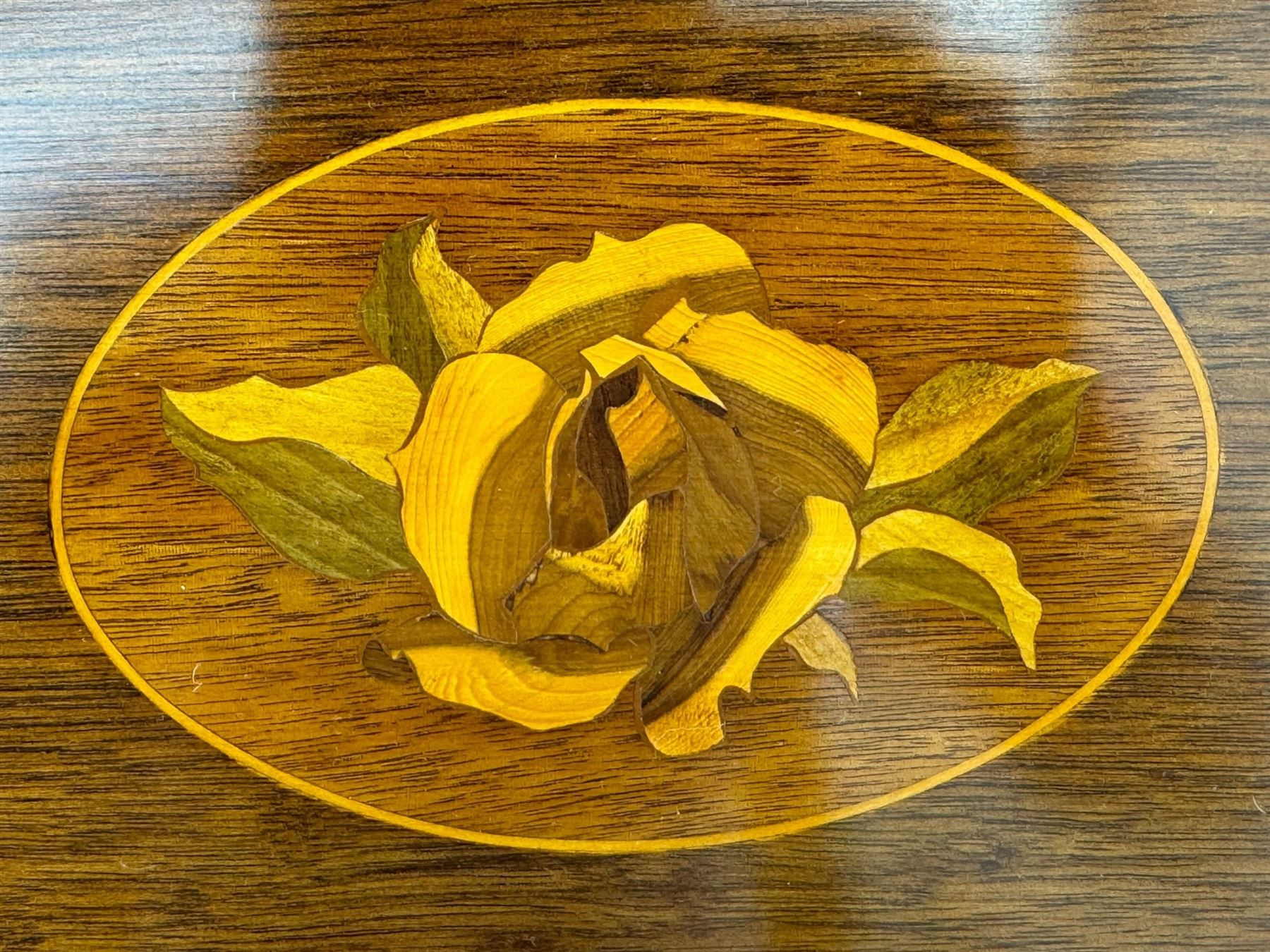 Mid-to-late 20th century inlaid mahogany bureau, inlaid floral medallion to the top, the fall front opening to reveal fitted interior with pigeonholes, small drawers and central cupboard, green inset writing surface with gilt tooling, four drawers below with brass handles, raised on shaped bracket feet