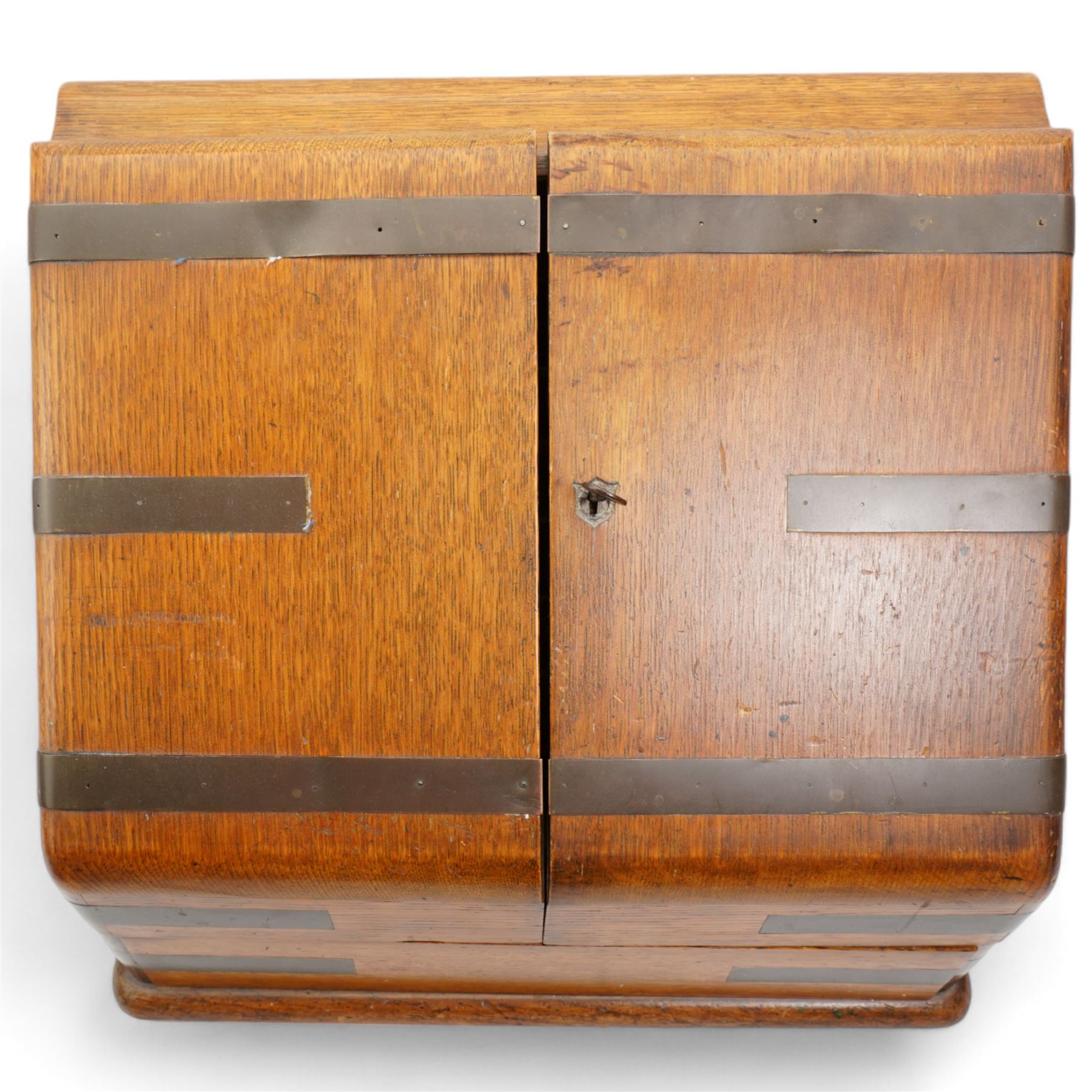 Edwardian oak correspondence box, the hinged sloping front enclosing a fitted interior incorporating a stationery rack, perpetual calendar, pen tray and two glass inkwells, H32cm x W40cm