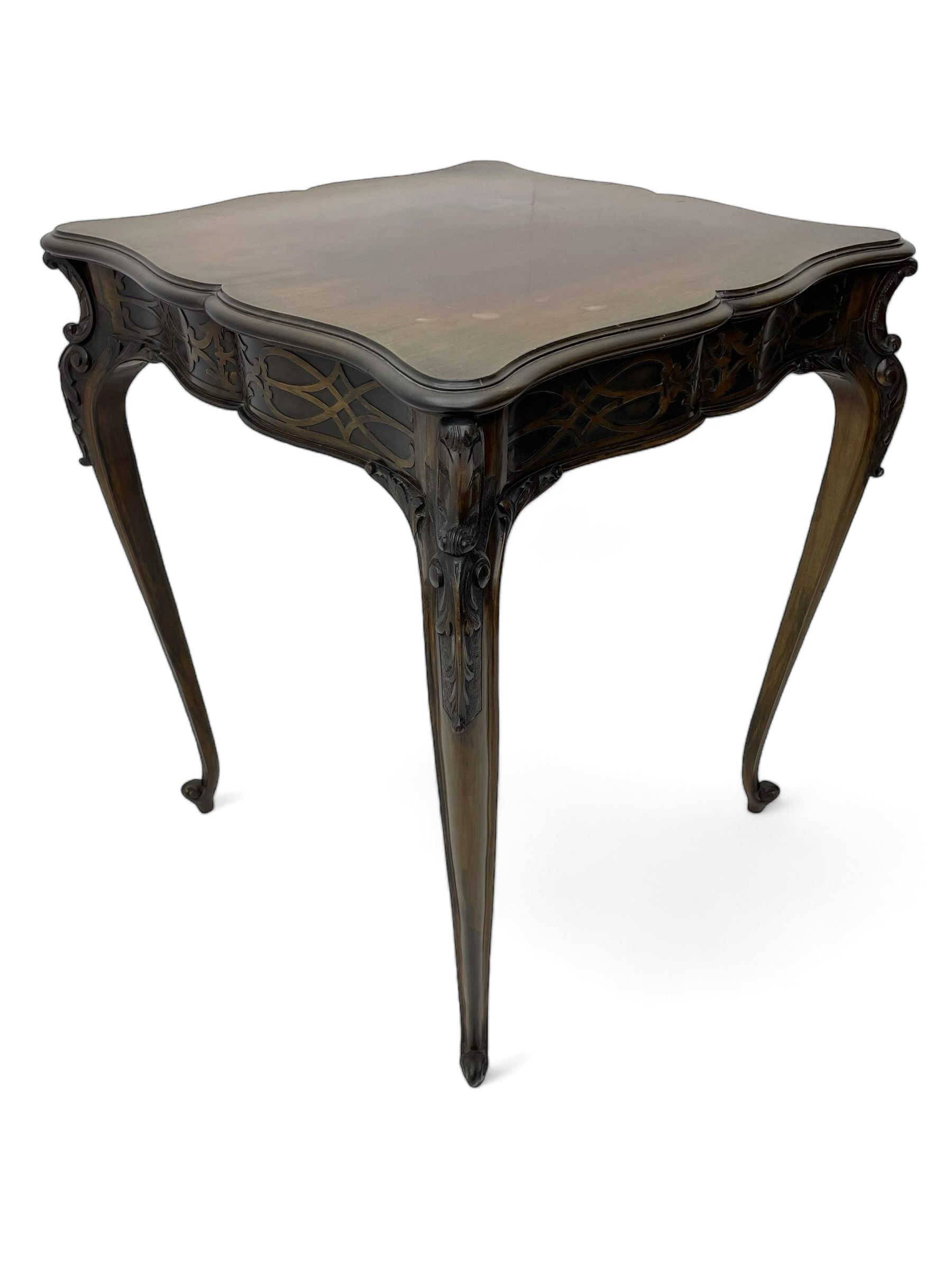 Early 20th century mahogany centre table, shaped moulded top over shaped frieze rails decorated with blind fretwork, on C-scroll and acanthus leaf carved cabriole supports with scrolled terminals 