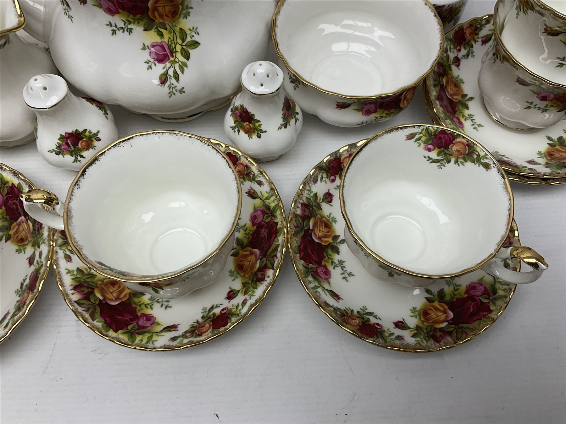 Royal Albert Old Country Roses pattern tea service for six, comprising teapot, sucrier, milk jug, dessert plates, one cake plate, one two tiered cake stand, salt and pepper pots and bud vase 