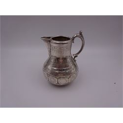 Arts and Crafts silver jug, of bellied form with C handle, the body engraved with a band of floral panels, with engraved scrolling and foliate decoration throughout, hallmarked hallmarked Samuel Smily, Goldsmiths Alliance, London 1873, H13cm