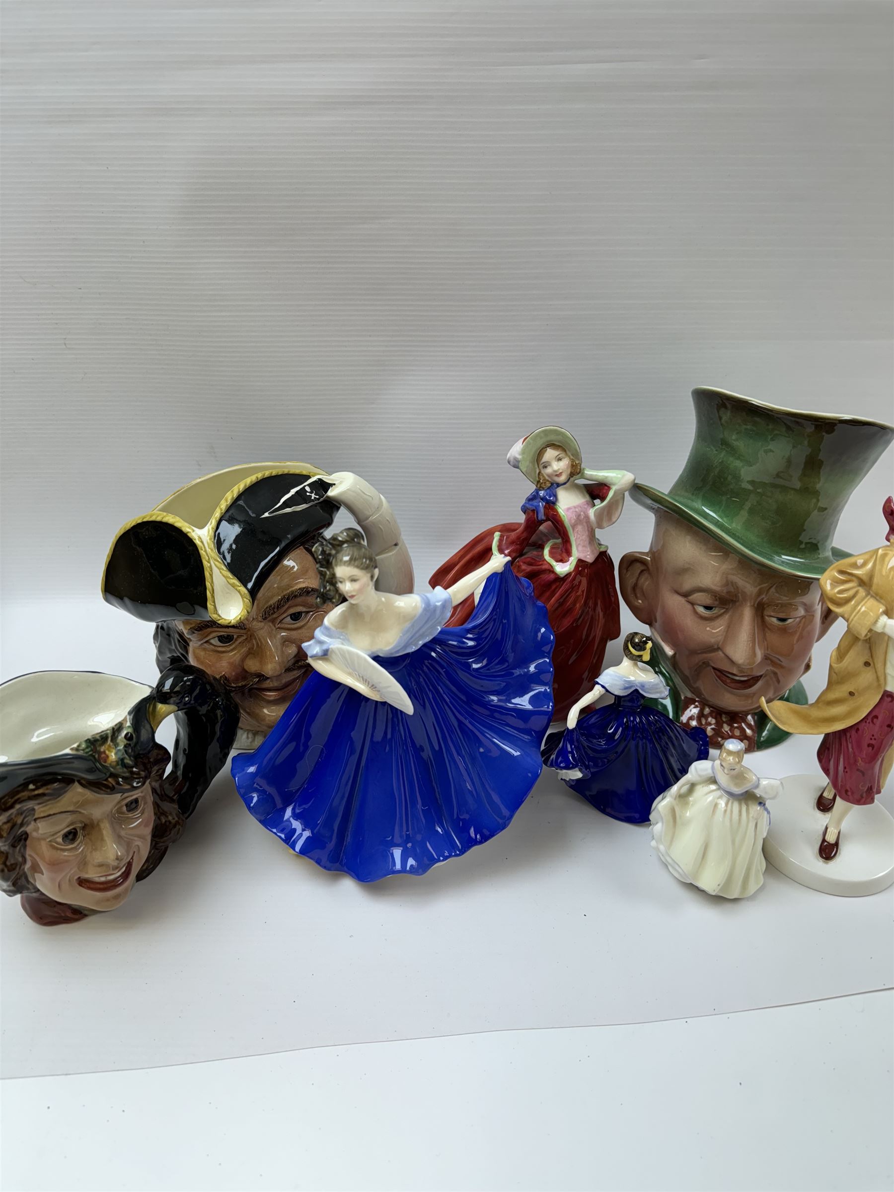 Five Royal Doulton figures, including Ruth, Autumn Breeze, Elaine, together with two Royal Doulton character jugs and Beswick character jug 