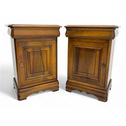 Pair of French cherry bedside cabinets, each with moulded rectangular top over panelled cu...