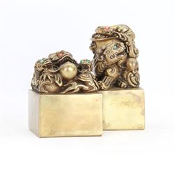 Two contemporary Chinese solid cast brass dragon desk seal, set with turquoise and coral eyes