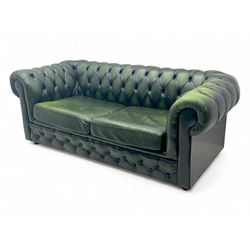 Two seat Chesterfield design sofa bed, upholstered in emerald green leather with deep-butt...