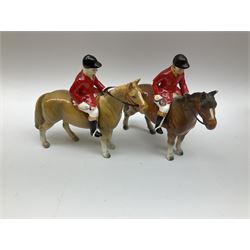 Beswick Hunting Group, comprising: two huntswoman on grey horses, model no 1730, huntsman on a bay horse, model no 1501, a seated fox, model no 1748, eighteen fox hounds and a spaniel, model no 967, all with printed marks beneath, together with three other ceramic huntsman on horseback and two hounds. 