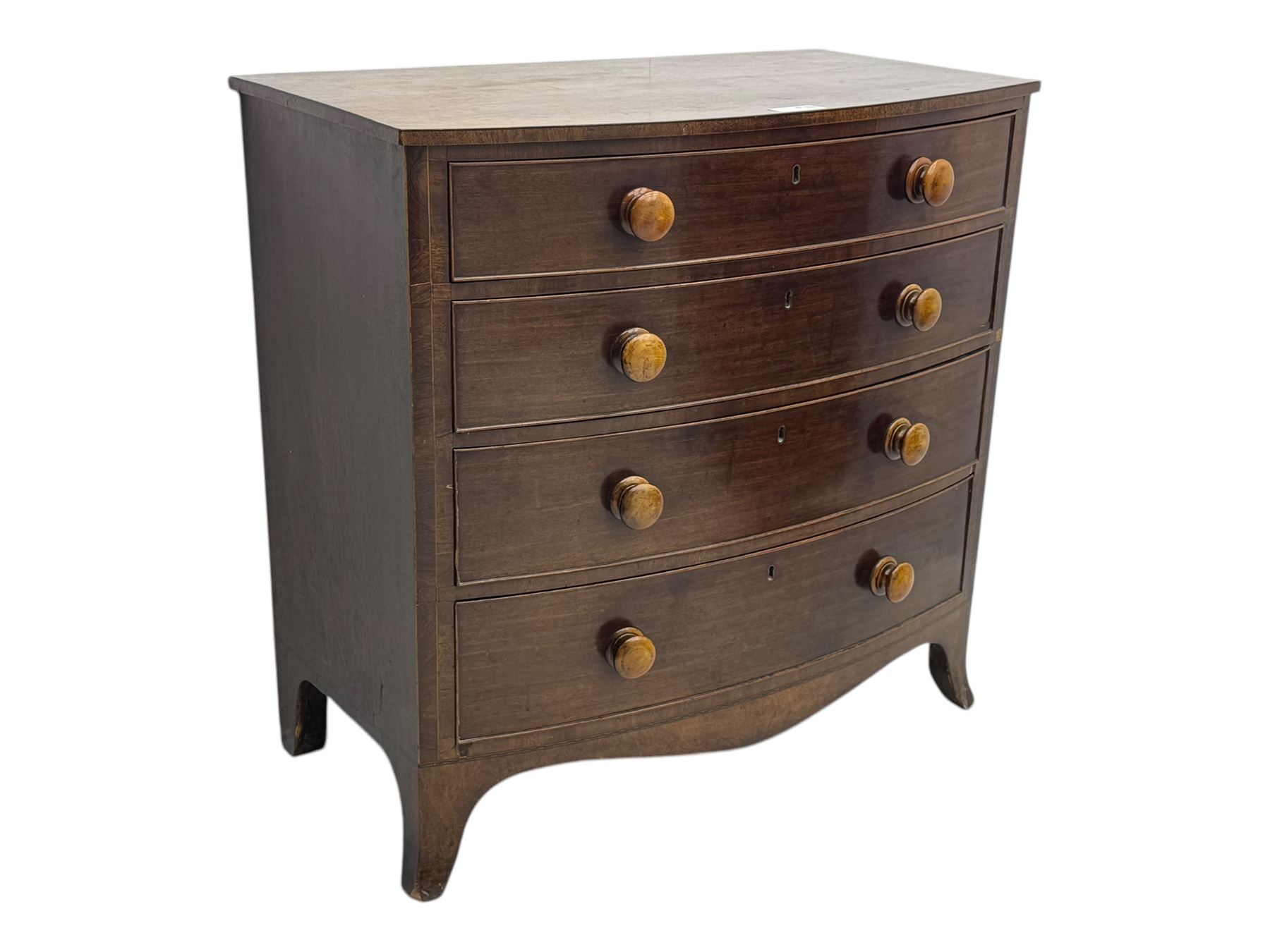 Victorian mahogany bow-fronted chest, fitted with four long graduating cock-beaded drawers, shaped apron on splayed bracket feet