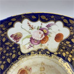 19th century continental bowl, decorated with hand painted floral sprays amongst gilt foliate decoration on a cobalt blue ground, D27.5cm