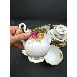 Royal Albert Old Country Roses tea service for six, comprising teapot, milk jug, open sucrier, cups and saucers, dessert plates, two trinket dishes covered jar and clock