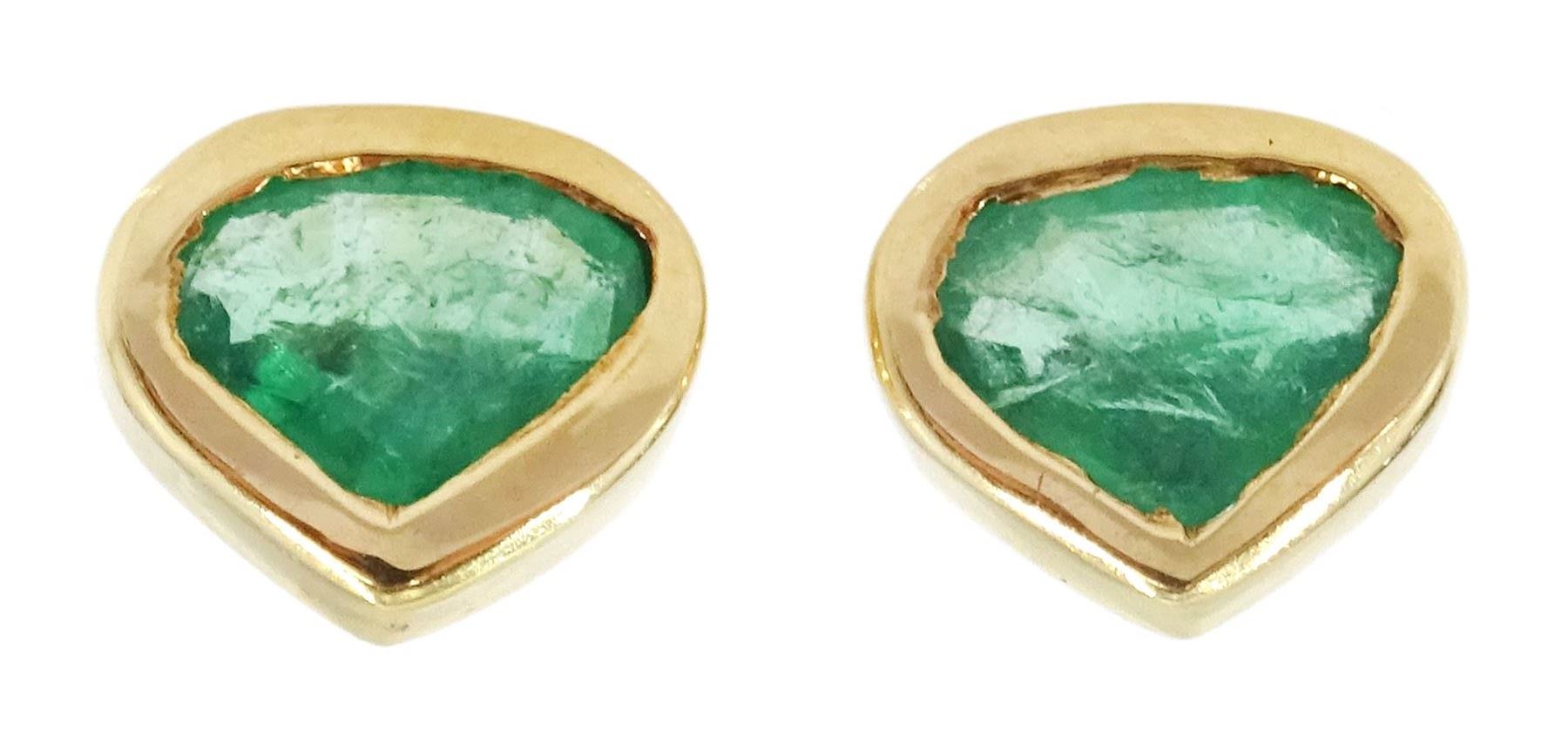 Pair of 18ct gold emerald stylized heart shaped earrings