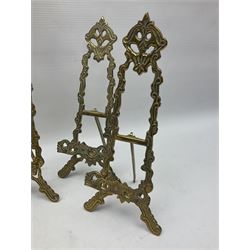 Set of six ornate cast brass easel stands, H30cm