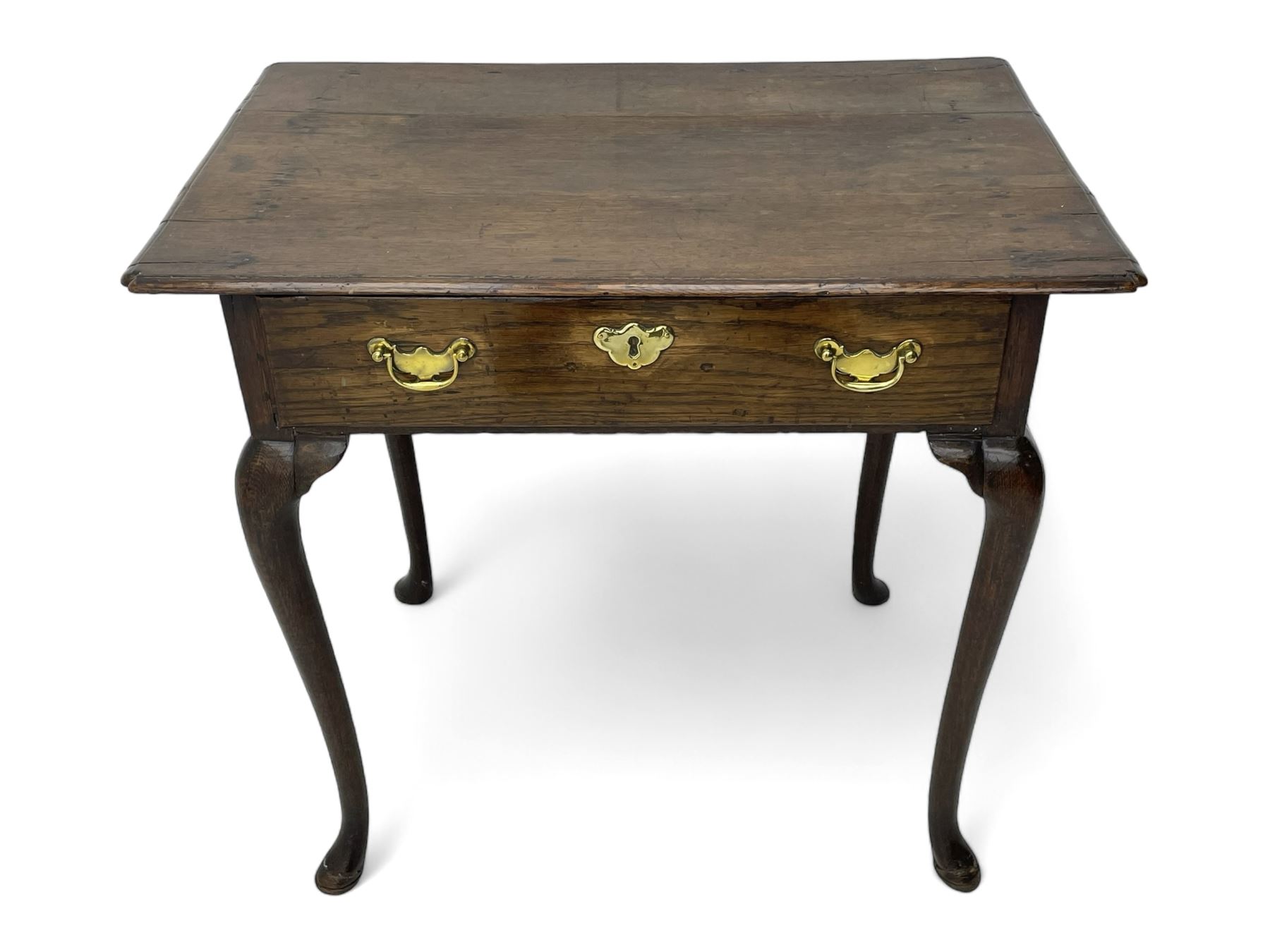 George III oak low-boy, moulded rectangular top with shaped corners, fitted with single drawer, shaped brass handle plates and escutcheon, on cabriole supports 