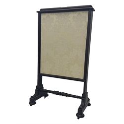 Early 19th century mahogany fire screen, upholstered in cream foliate pattern fabric, pull-up panel and sliding panel, raised on platforms united by turned and lappet carved stretcher, on compressed bun feet with castors 