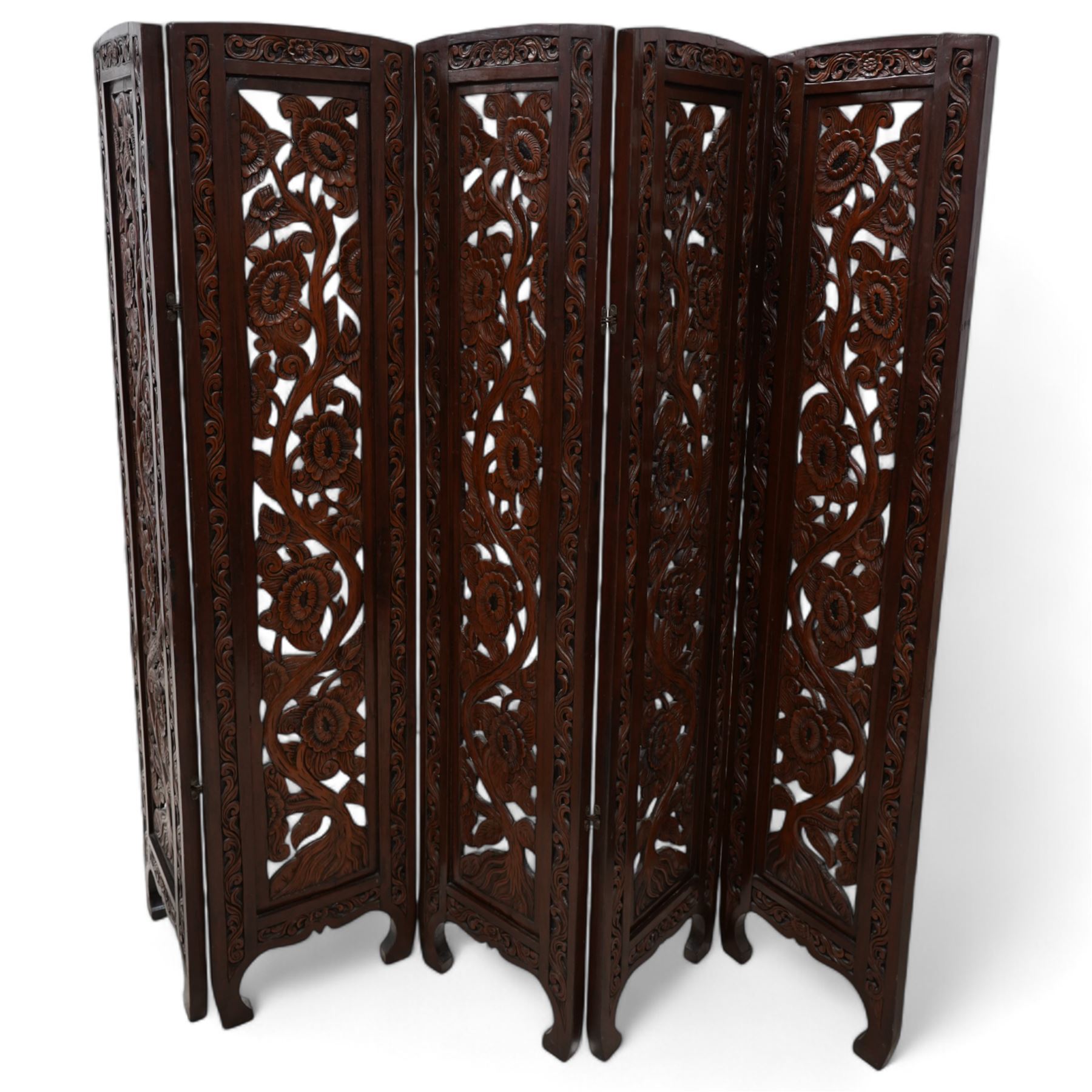 Hardwood five panel screen, carved and pierced with trailing branches and flowerheads 