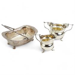  Victorian silver rectangular sugar basket with swing handle decorated with garlands and foliage on ball feet W15cm Sheffield 1891 Maker James Dixon & Son and a silver cream jug and sugar bowl Chester 1919 