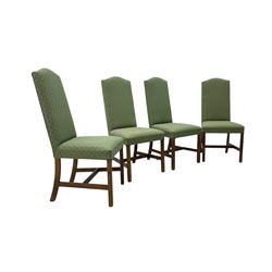 Early 20th century oak extending dining table, rectangular top with rounded corners, on turned baluster supports united by X-stretchers, fitted with a pull-out extending mechanism (106 x 142 - 228cm, H76cm); set of eight high-back dining chairs upholstered in green fabric with geometric diamond pattern