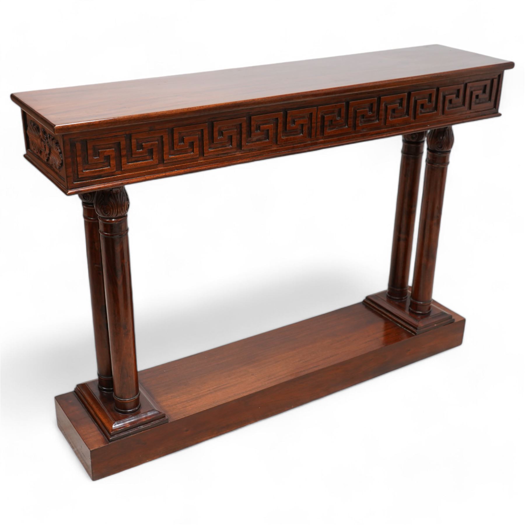 Neoclassical design mahogany console table, rectangular top over Greek key carved frieze with foliate carved back and sides, raised on twin pilaster end supports with acanthus capitals, on a plinth base