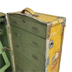 Early 20th century steamer traveling trunk, in yellow finish with chrome fixtures, the interior fitted with drawers and hangers, with various travel labels 