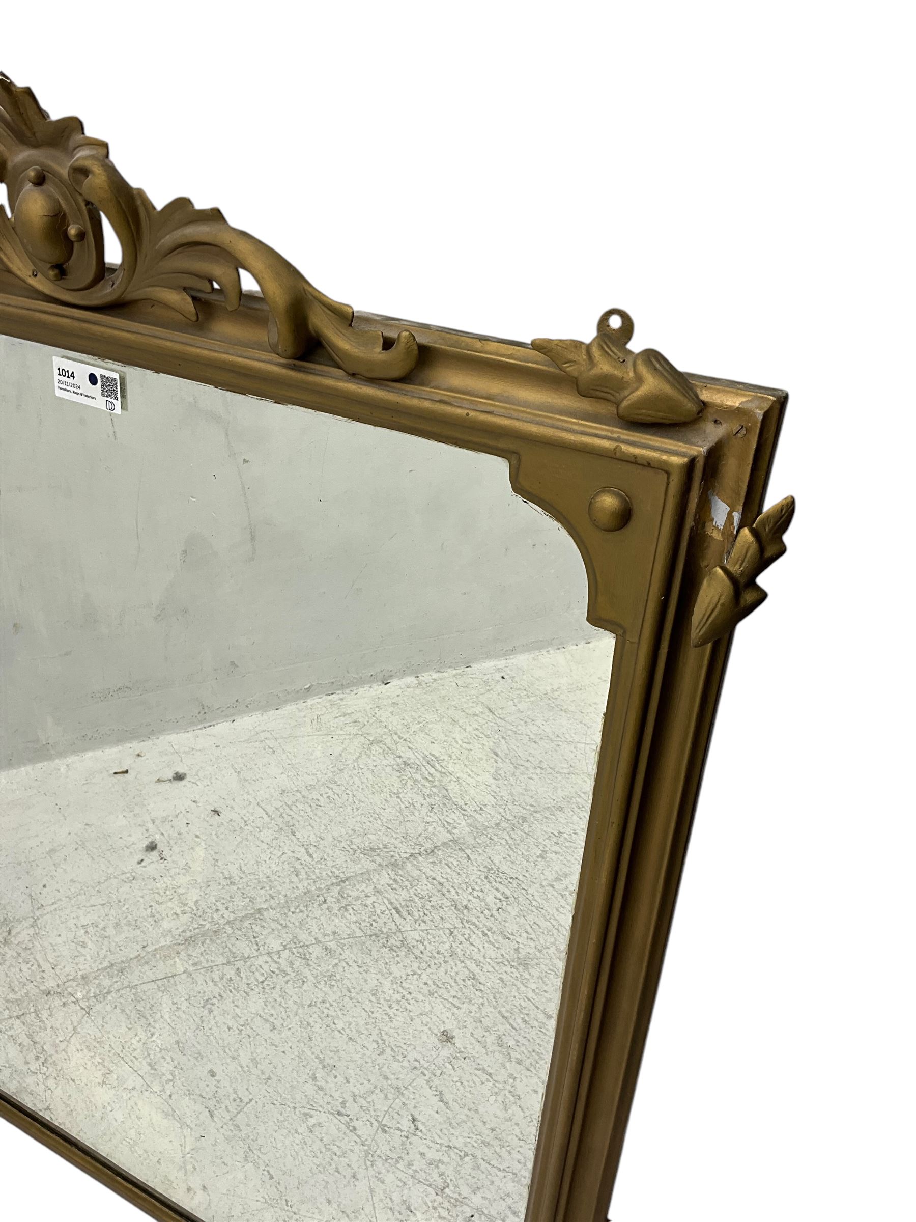 19th century gilt framed overmantel mirror, cartouche pediment surrounded by curling leaves, moulded framed enclosing plain mirror plate, decorated with applied trailing foliage motifs 