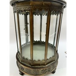 Pair of patinated brushed brass lanterns, of domed hexagonal form, with pierced gallery and swing handle, H63cm 


