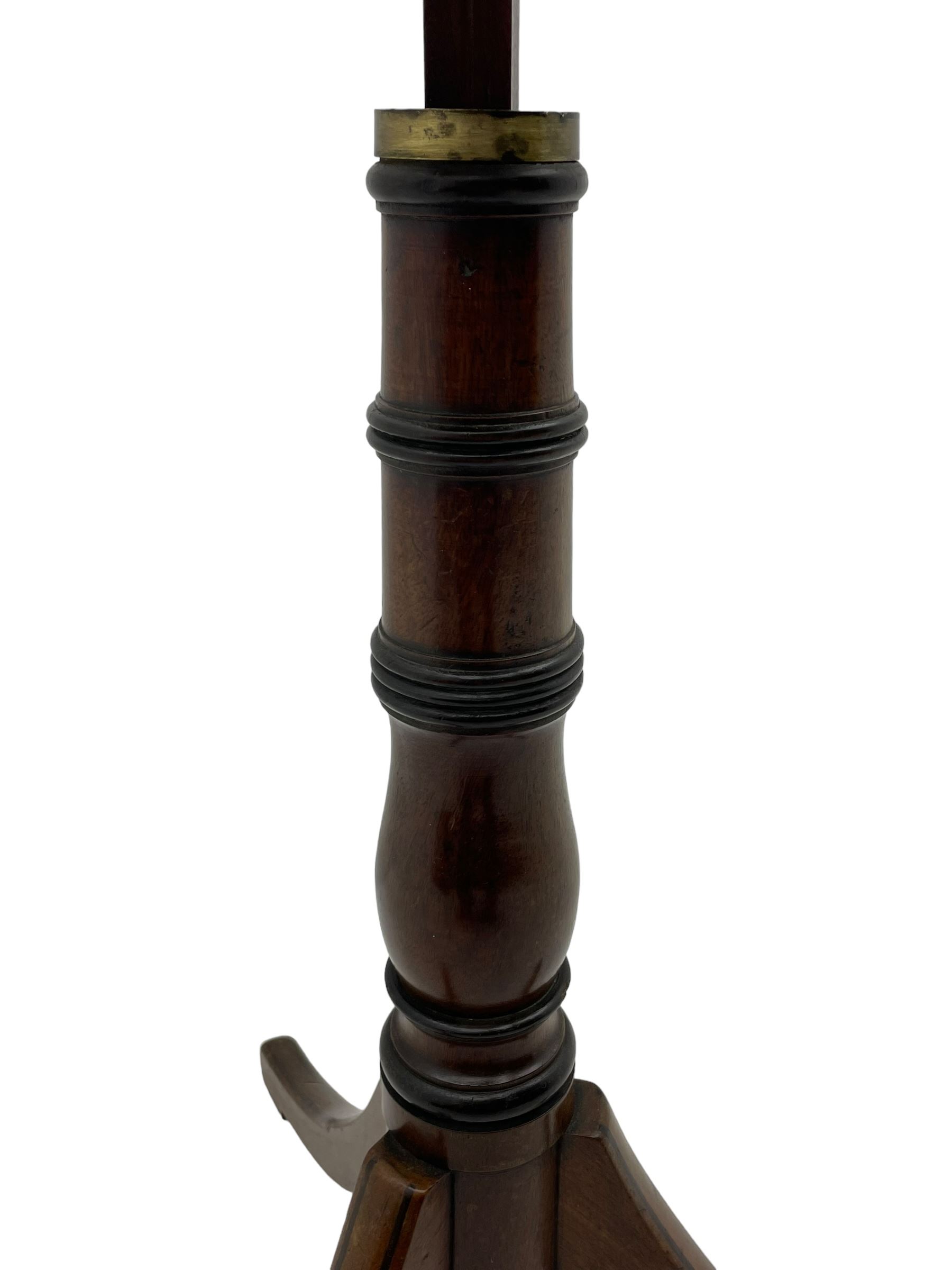 Regency mahogany reading stand, rectangular top with rounded corners on adjustable hinged mechanism, collar turned column on three out-splayed supports, inlaid with ebony stringing 