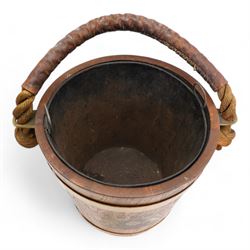 Oak and brass banded fire bucket decorated with the Royal Coat of Arms with liner and rope twist handle H30cm, together with a Dunhill 'The White Spot' faceted mahogany tobacco jar and cover (2)