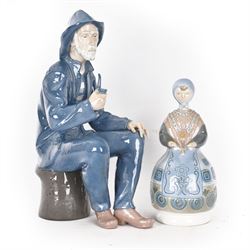 Lladro figure, Girl in Traditional Dress no 1159, together with Nao figure Old Fisherman Smoking a Pipe