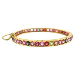 19ct gold multi gemstone hinged bangle, including topaz and tourmaline, the sides with bright cut decoration