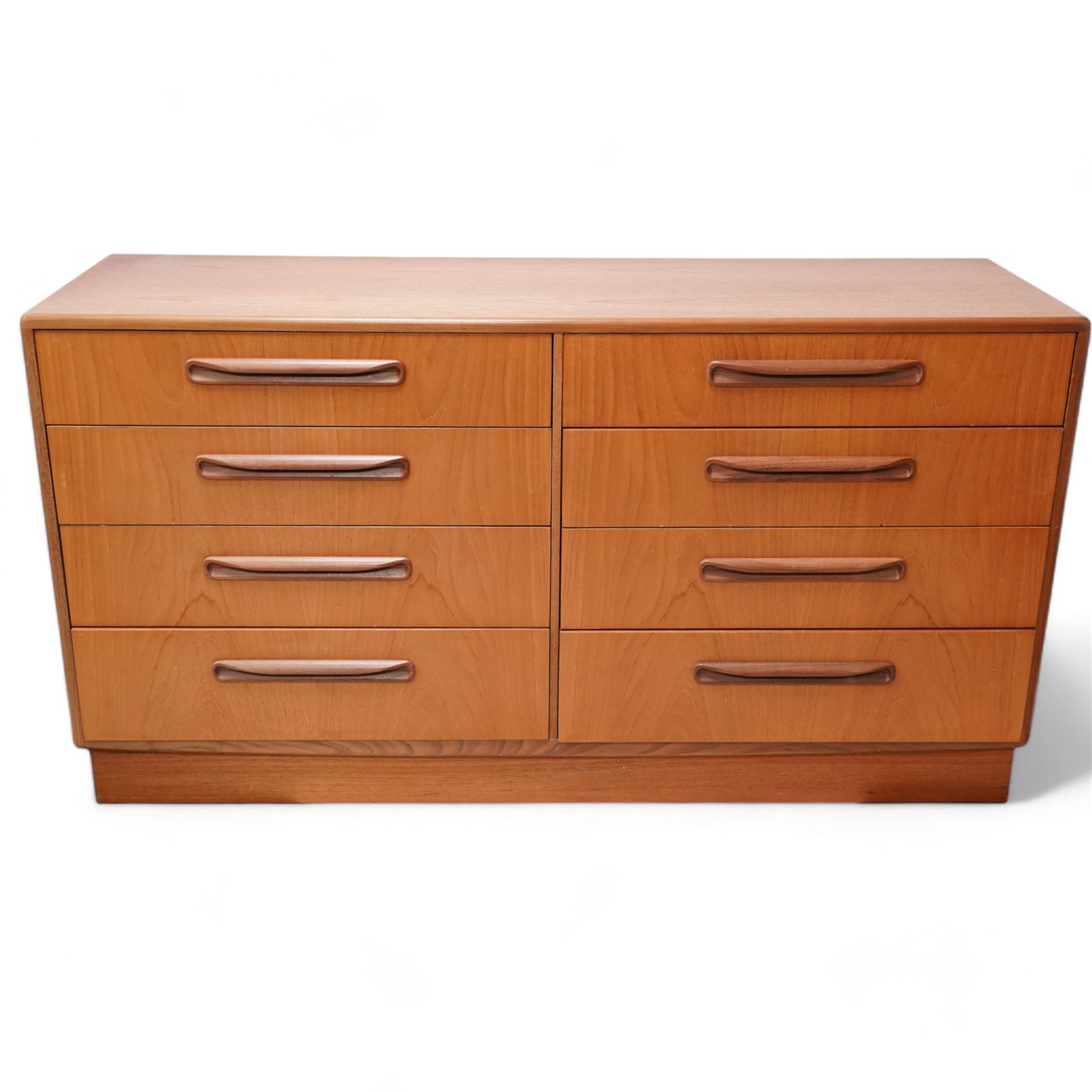 G-Plan - mid-20th century 'Fresco' teak wideboy chest, fitted with eight drawers, on skirted base