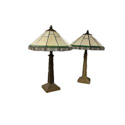 Pair of Tiffany style lamps with geometric patterns, H52cm