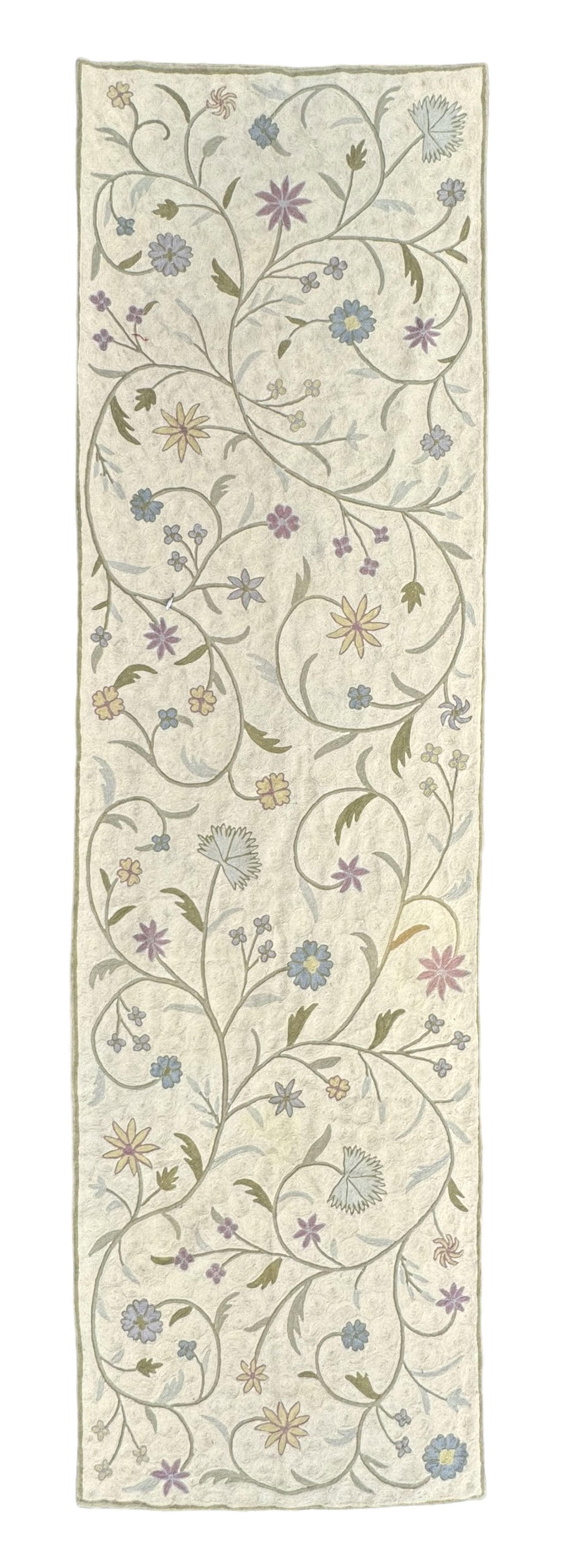 Kashmiri hand-stitched wool chain runner, featuring a cream ground decorated with meandering vines and an array of pastel flowers, enclosed by a plain light green border