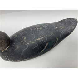 Early 20th century American carved wooden decoy duck, with weight beneath marked CJ Raymond Lead Co Chicago, Ill, H18cm, L38cm 