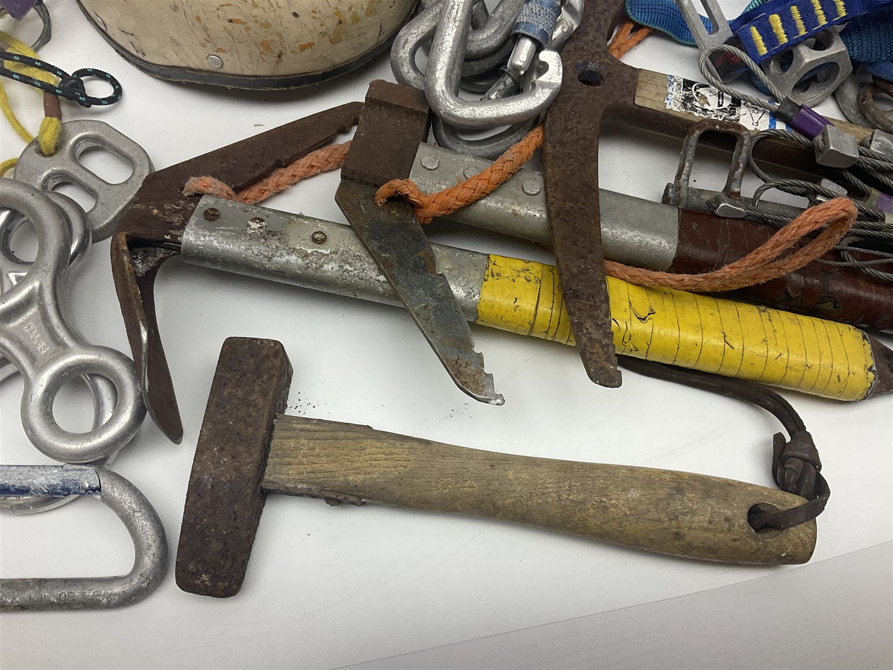 Collection of 1960s/70s climbing equipment including two original Hamish McInnes Pterodactyl ice axes, Joe Brown helmet, carabiners, ropes and wires etc