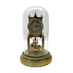 Gustav Becker - German torsion clock, serial No 2086578, on a circular brass base with a glass dome, silvered dial with Arabic numerals and steel spade hands, circular oscillating pendulum, torsion spring intact.