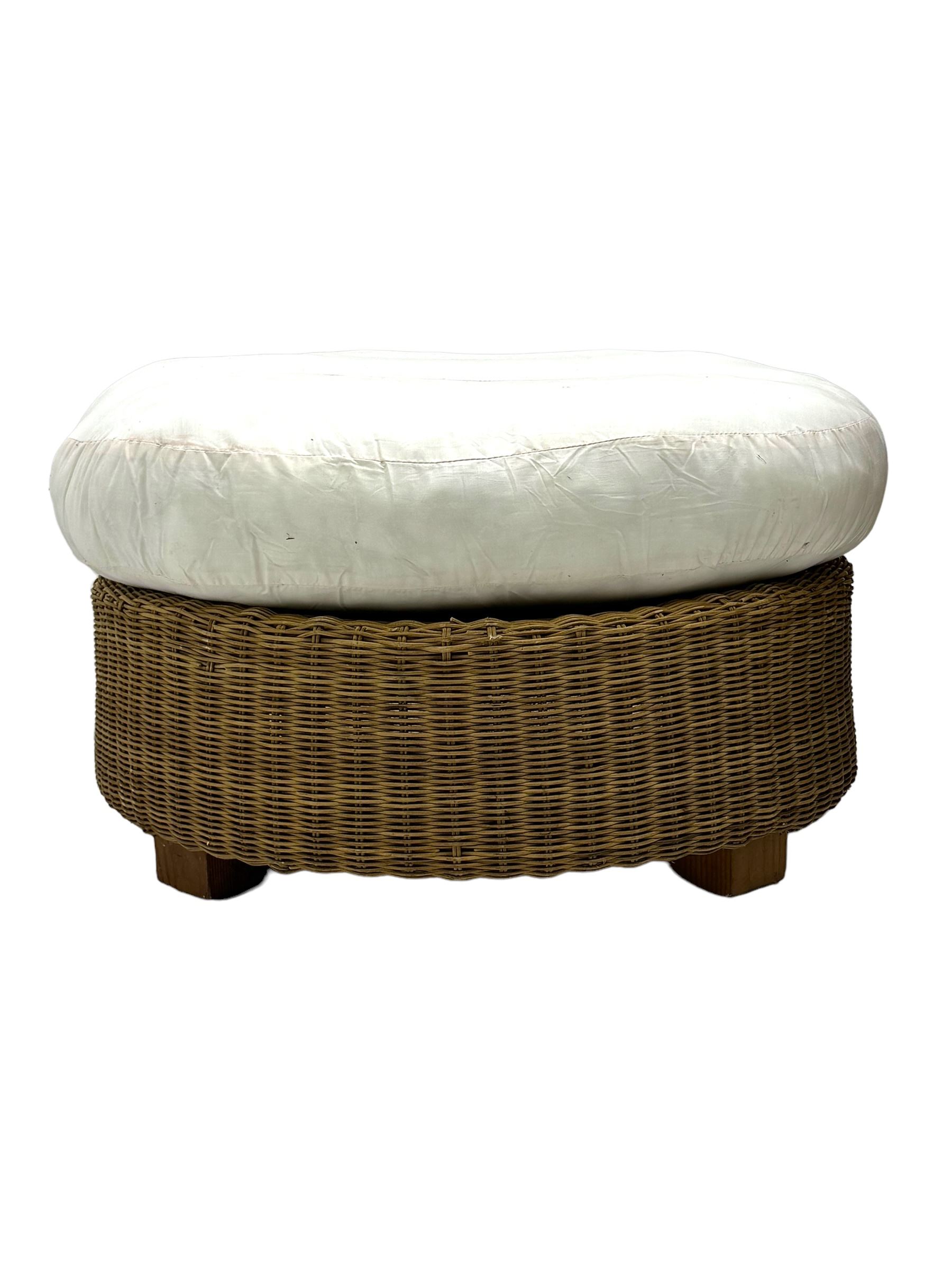 Rattan armchair and ottoman set, pair of armchairs featuring rounded backrests with wide armrests, woven wicker frame with weaving and upholstered seat cushions in off-white fabric with flowing floral pattern (W83 D80 H78cm); matching round ottoman with upholstered cushion on square wooden feet (W65 D65 H37cm)