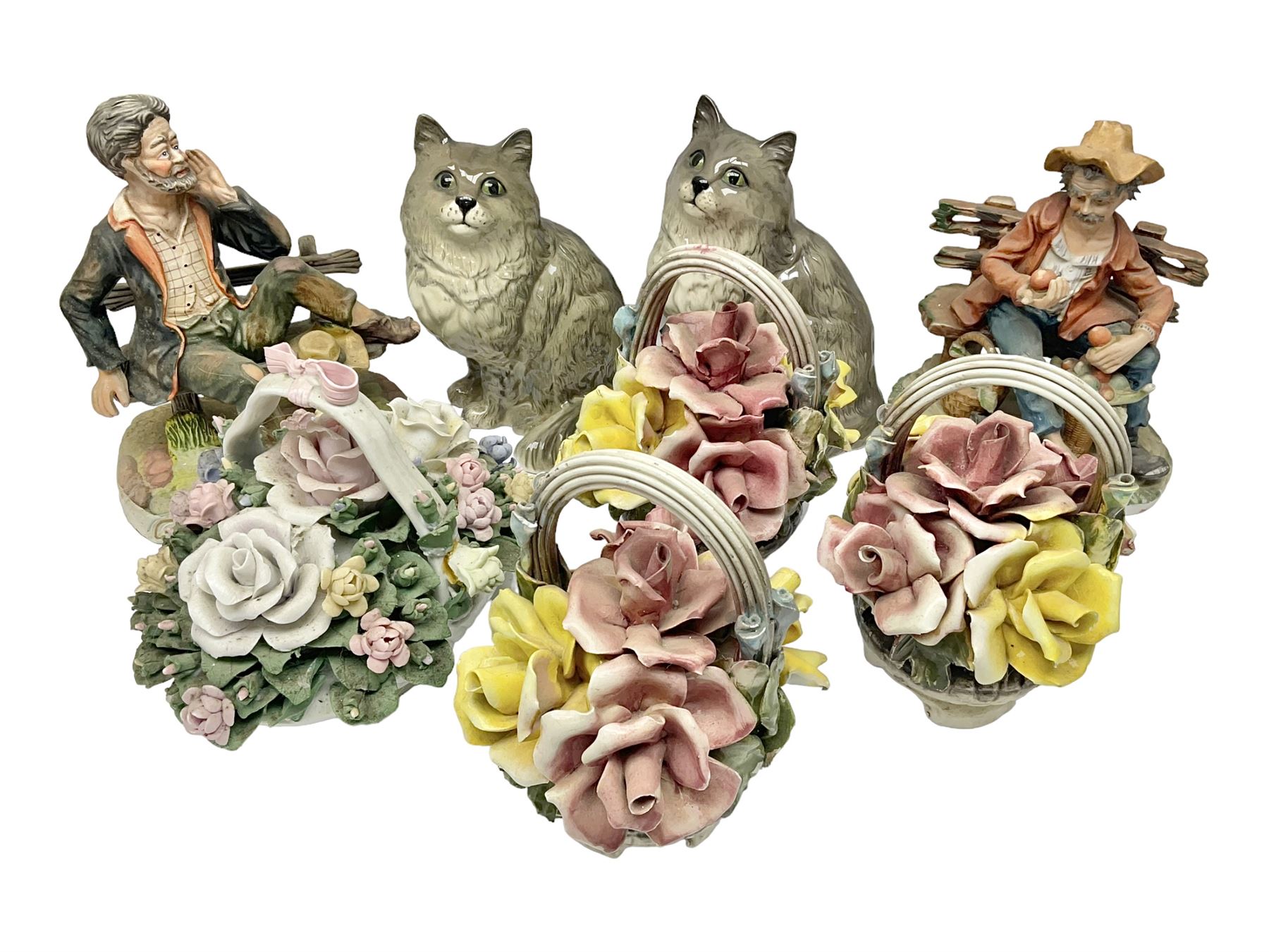 Two Royal Doulton cats, two Capodimonte style figures, and four ceramic baskets of flowers 