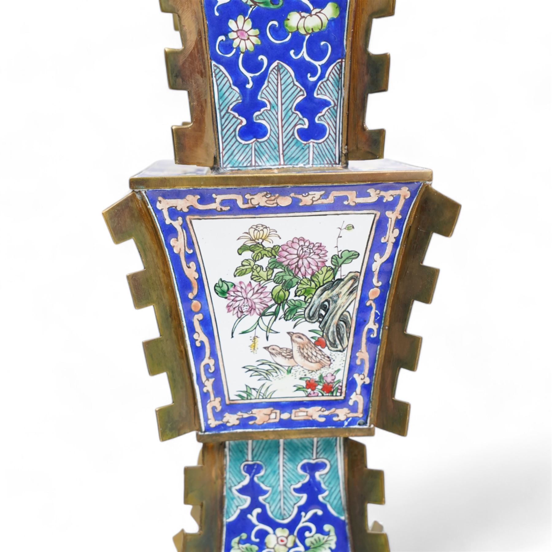 20th century Chinese brass and enamel Zun form vase, decorated with figures and birds in panels, lappet borders and trailing foliage against a blue ground, on pierced rectangular stand, H38cm