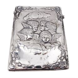 Late Victorian silver card case, of rectangular form with rounded corners, embossed with four putti amongst clouds, engraved with initials verso, hallmarked Henry Matthews, Birmingham 1900, H10.5cm