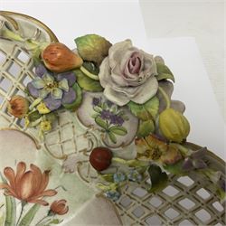 19th Meissen style centrepiece, with pierced lattice work sides and decorated in relief with fruit and floral sprigs, upon four scrolled feet, with spurious mark beneath H9cm D31cm