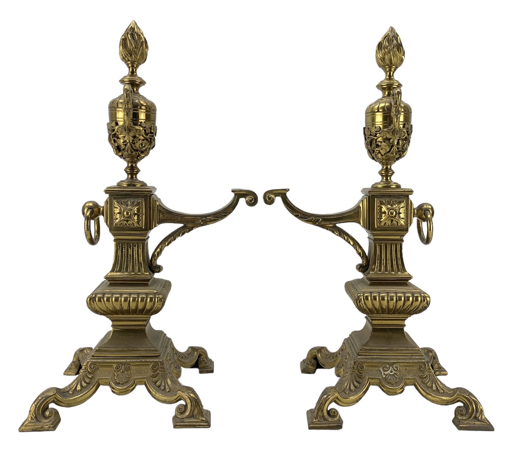 Pair of late Victorian cast and gilt brass fire dogs, circa 1894, with flaming urn finials raised upon columnar supports and four scroll feet, Rd227713, H47cm  