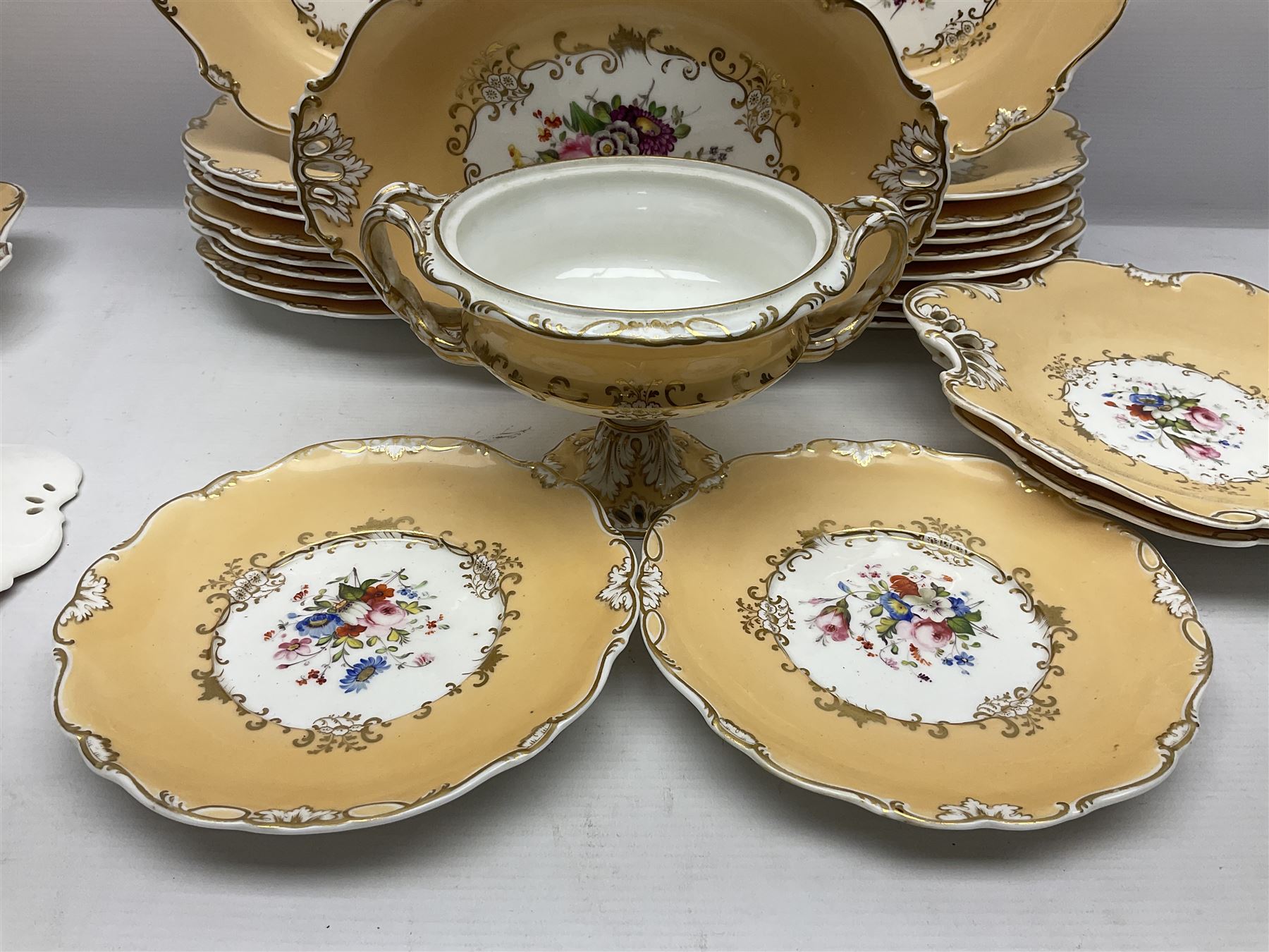 Victorian part dessert service, including eighteen plates, four small serving dishes, shallow dish, etc hand painted with floral sprigs within a cream border with floral panels, and heightened in gilt (26cm)