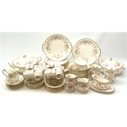Paragon Victoriana Rose pattern tea and dinnerware, comprising fourteen teacups, sixteen saucers, fourteen side plates, two milk jugs, two open sucriers, two sandwich plates, a cake stand (lacking central support), two tureen and covers, eight dinner plates, twenty one dessert plates, eleven bowls, and sauce boat and stand. 